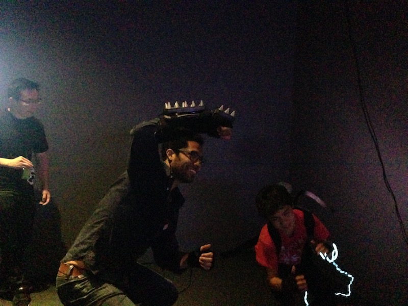 Players Ducking from enemy at 2016 Indiecade Strange Arcade show at Museum of the Moving Image.
